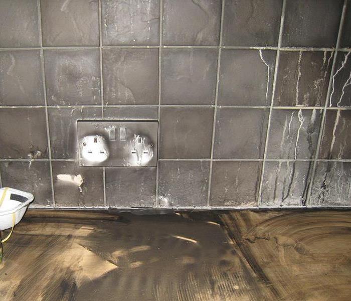 Soot contaminated kitchen tile